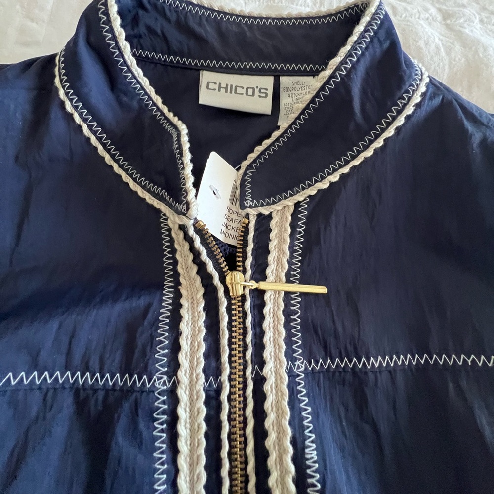 Chicos Navy blue waterproof. windbreaker.  XL.  New with tag on. Zipper front.